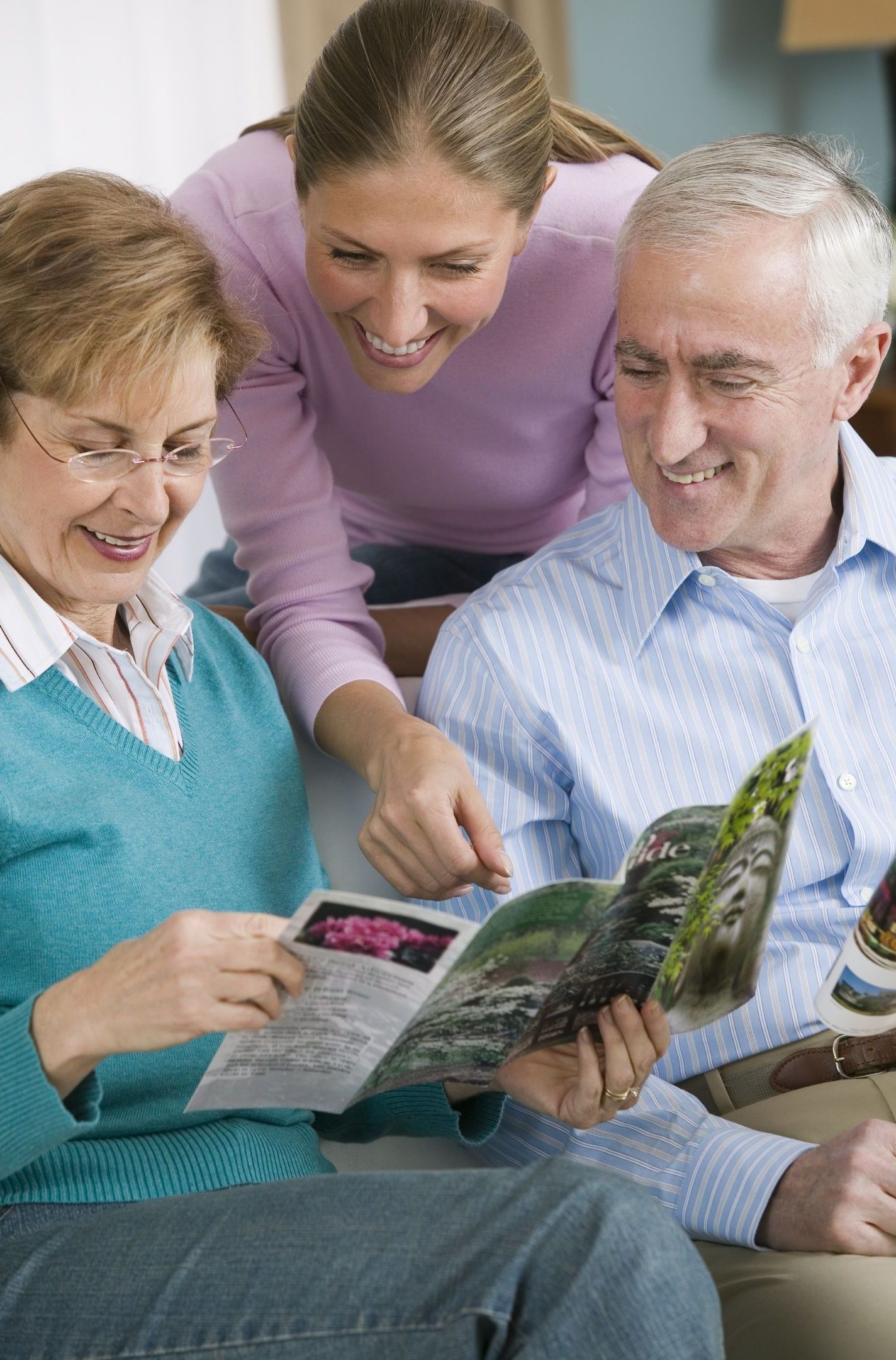 Family looking at brochure for branding collateral