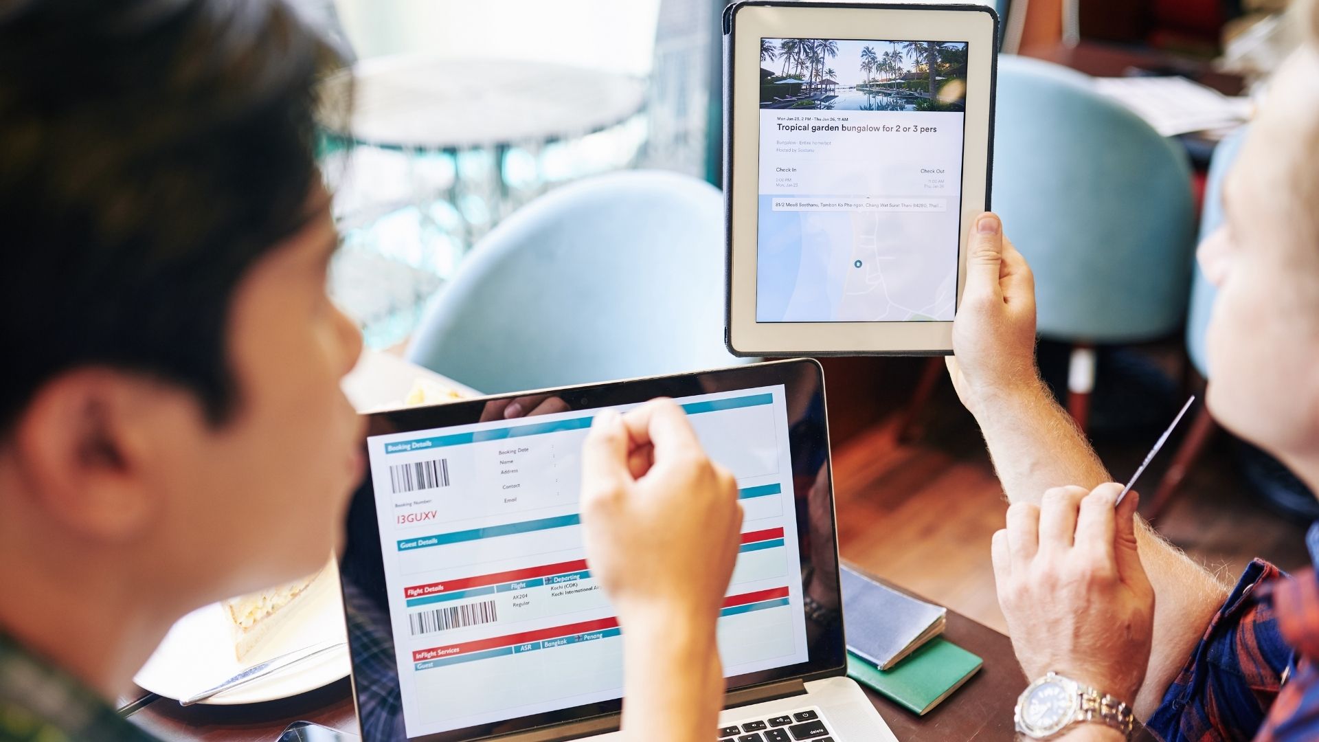 Two male digital marketing managers diligently reviewing and analyzing their client's digital presence process on a tablet.