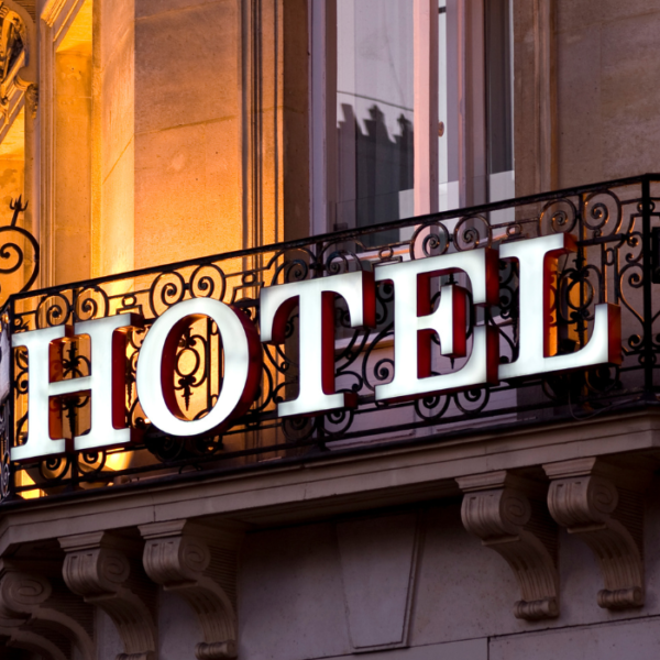hotel digital marketing strategy blog banner: hotel sign on a building