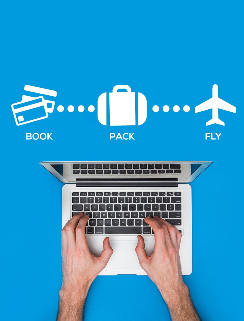 two-male-hands-typing-of-macbook-air-with-blue-background-and-icons-of-booking-packing-and-plane