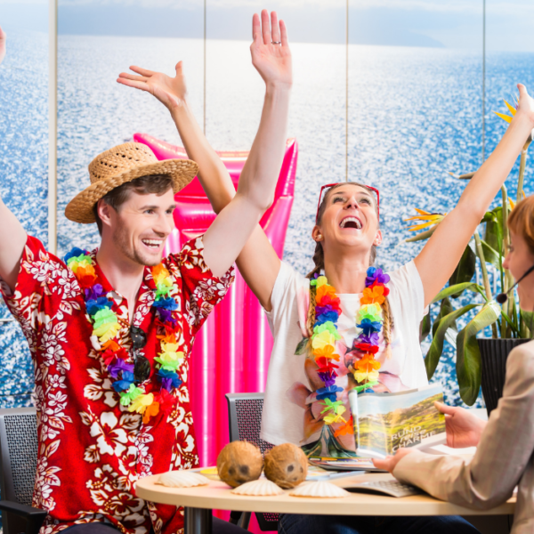 A couple in Hawaiian shirts raise their hands up with a happy expression because SEO for travel websites is good